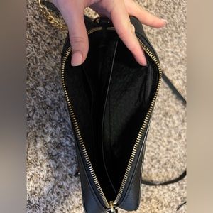 Large Michael Kors cross body purse with matching wallet.
